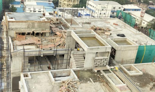 An image of Tower 1 Above Terrace Oht Wall And Cover Slab Work Completed showing construction status of DRA Infinique residential Properties in Valasaravakkam, Chennai as on 19th February 2026